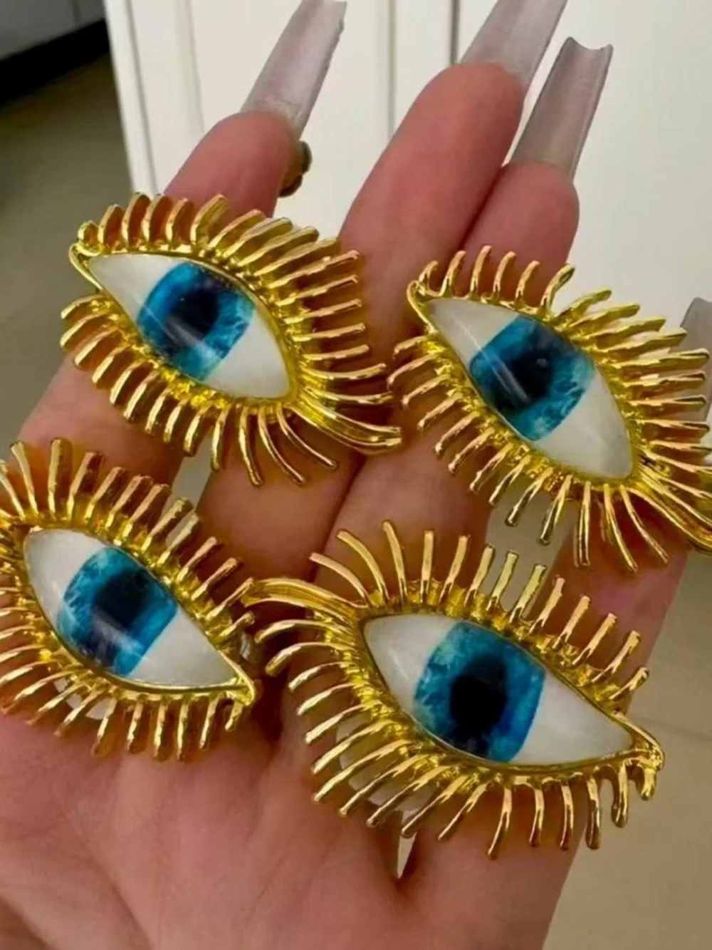 Schiaparelli Gold Eye Statement Earrings with Blue Iris